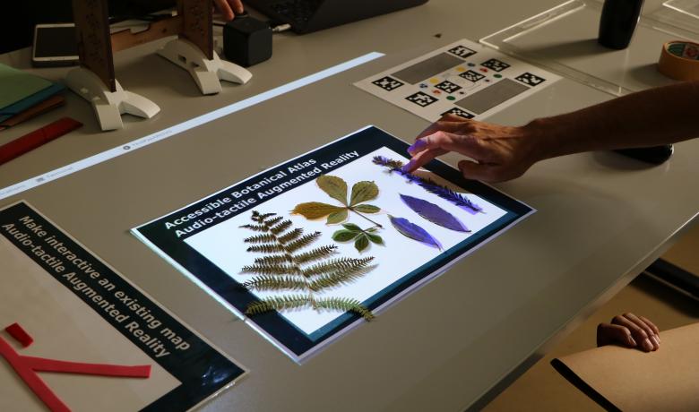 An audio tactile botanical atlas developed for VISTE is being presented to the teachers during a hands-on workshop with the VISTE augmented reality tool for inclusive classrooms. 